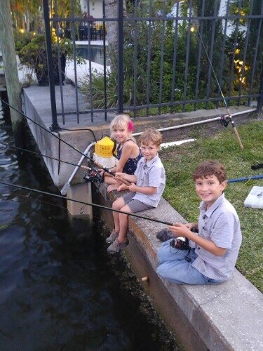 Group of children fishing in Tampa Bay Florida